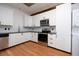 Modern kitchen featuring new appliances and sleek, white cabinetry at 20 Marietta St # 4B, Atlanta, GA 30303
