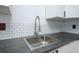 Modern kitchen sink with a pull-down sprayer and stainless steel fixtures at 20 Marietta St # 4B, Atlanta, GA 30303