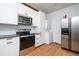 Bright kitchen features stainless steel appliances and a convenient in-unit washer and dryer at 20 Marietta St # 4B, Atlanta, GA 30303