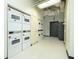 Community laundry room with multiple rows of washing and drying machines at 20 Marietta St # 4B, Atlanta, GA 30303