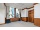 Living room featuring large windows, traditional trim, and neutral carpeting at 20 Marietta St # 4B, Atlanta, GA 30303