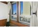 Close up of large windows showing a view and decorative black and beige curtains at 20 Marietta St # 4B, Atlanta, GA 30303
