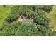 Aerial photograph displays a home enveloped by dense tree coverage, providing a serene setting at 527 Gaddis Rd, Canton, GA 30115