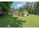 Large backyard with a well-maintained lawn and trees at 527 Gaddis Rd, Canton, GA 30115