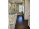 Bright bathroom with a glass enclosed shower, soaking tub, granite counters, and storage cabinets at 527 Gaddis Rd, Canton, GA 30115