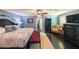 Spacious bedroom with wooden floors, blue walls, and a king size bed at 527 Gaddis Rd, Canton, GA 30115