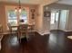 Cozy dining room with dark wood floors, natural light, and a view of the outdoors at 527 Gaddis Rd, Canton, GA 30115