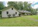 Beautifully landscaped yard and inviting facade complement this well-maintained brick home at 527 Gaddis Rd, Canton, GA 30115
