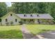 Charming single-story home with a beautifully landscaped front yard and a welcoming entrance at 527 Gaddis Rd, Canton, GA 30115