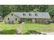 Charming single-story home with a beautifully landscaped front yard and a welcoming entrance at 527 Gaddis Rd, Canton, GA 30115