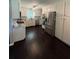 Open kitchen featuring a refrigerator, stainless steel appliances, granite countertops, and cabinets at 527 Gaddis Rd, Canton, GA 30115