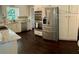 Bright kitchen with stainless appliances, double oven, granite countertops, and white cabinets at 527 Gaddis Rd, Canton, GA 30115