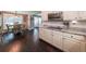 Kitchen with white cabinets, stainless appliances, granite counters, and a hardwood floor at 527 Gaddis Rd, Canton, GA 30115