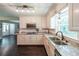 Bright kitchen with white cabinets, stainless appliances, granite counters, and hardwood floors at 527 Gaddis Rd, Canton, GA 30115