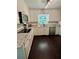 Bright kitchen featuring white cabinets, granite countertops, and stainless steel appliances at 527 Gaddis Rd, Canton, GA 30115