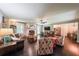 Cozy living room featuring a fireplace, hardwood floors, and an adjacent dining area at 527 Gaddis Rd, Canton, GA 30115
