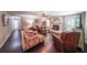 Spacious living room with a fireplace, hardwood floors, and lots of natural light at 527 Gaddis Rd, Canton, GA 30115