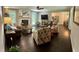 Spacious living room featuring a fireplace, hardwood floors, and comfortable seating with modern appliances at 527 Gaddis Rd, Canton, GA 30115