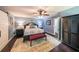 Spacious main bedroom with hardwood floors, a ceiling fan, and a decorative bed at 527 Gaddis Rd, Canton, GA 30115
