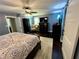 Comfortable main bedroom with dark wood floors, soft rug, sliding barn door and blue walls at 527 Gaddis Rd, Canton, GA 30115