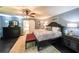 Spacious main bedroom with hardwood floors, a ceiling fan, and a decorative bed at 527 Gaddis Rd, Canton, GA 30115