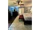 Spacious bedroom with dark wood floors, area rug, sliding barn door access to bathroom, and blue walls at 527 Gaddis Rd, Canton, GA 30115