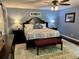 This main bedroom features an area rug, dark wood floors, and decorative bedside lighting at 527 Gaddis Rd, Canton, GA 30115