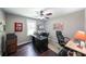 Bright office with hardwood floors, a ceiling fan, and a large desk at 527 Gaddis Rd, Canton, GA 30115