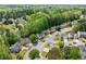 A neighborhood with mature trees is showcased in this aerial view of the houses at 610 Durham Ridge Nw Dr, Lilburn, GA 30047