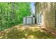 Private backyard features mature trees, storage shed and covered patio at 610 Durham Ridge Nw Dr, Lilburn, GA 30047