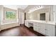 Spacious bathroom boasts double vanity and garden tub by a large window at 610 Durham Ridge Nw Dr, Lilburn, GA 30047
