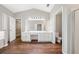 Bright bathroom with a double sink vanity, large mirror, separate toilet, and a walk-in closet at 610 Durham Ridge Nw Dr, Lilburn, GA 30047