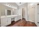 Bright, modern bathroom with double sinks, a large vanity area, and a glass-enclosed shower at 610 Durham Ridge Nw Dr, Lilburn, GA 30047