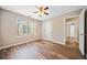 Bedroom with natural light, hardwood floors, and a spacious closet at 610 Durham Ridge Nw Dr, Lilburn, GA 30047