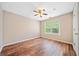 Neutral bedroom features new hardwood floors and ceiling fan at 610 Durham Ridge Nw Dr, Lilburn, GA 30047