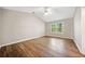 A cozy bedroom filled with natural light from a large window and ceiling fan, perfect for relaxation at 610 Durham Ridge Nw Dr, Lilburn, GA 30047