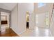 Bright foyer with high ceilings, tile floors, and a view to the second floor at 610 Durham Ridge Nw Dr, Lilburn, GA 30047