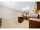 Bright kitchen with ample cabinets, stainless appliances, tiled floor, and a functional center island at 610 Durham Ridge Nw Dr, Lilburn, GA 30047