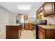 Well-equipped kitchen with stainless steel appliances, center island, and ample counter space for cooking at 610 Durham Ridge Nw Dr, Lilburn, GA 30047