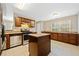 Modern kitchen features stainless steel appliances, granite countertops, tile floors and a center island at 610 Durham Ridge Nw Dr, Lilburn, GA 30047