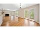 Open-concept room with wood floors, fireplace, and access to the backyard through French doors at 610 Durham Ridge Nw Dr, Lilburn, GA 30047