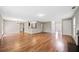 Open-concept living room featuring hardwood floors, lots of natural light, and neutral paint at 610 Durham Ridge Nw Dr, Lilburn, GA 30047