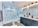 Modern bathroom with glass-enclosed shower and sleek double vanity at 1705 Ezra Church Nw Dr, Atlanta, GA 30314