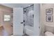 Modern bathroom with a tub, shower, and stylish fixtures next to a bedroom at 1705 Ezra Church Nw Dr, Atlanta, GA 30314