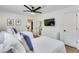 Bright bedroom with two twin beds, a ceiling fan, and a mounted TV at 1705 Ezra Church Nw Dr, Atlanta, GA 30314