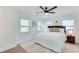 Inviting bedroom featuring a king bed, side tables, and multiple windows at 1705 Ezra Church Nw Dr, Atlanta, GA 30314
