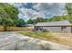 Rear exterior view of a home with a wooden deck and a spacious, grassy yard at 1705 Ezra Church Nw Dr, Atlanta, GA 30314