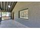 Spacious front porch with modern lighting, brick walls and a seating area at 1705 Ezra Church Nw Dr, Atlanta, GA 30314