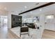 Open-concept living room with wood floors, a modern fireplace, and neutral decor at 1705 Ezra Church Nw Dr, Atlanta, GA 30314
