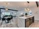 Open-concept living space features a stylish kitchen and an adjacent living area at 1705 Ezra Church Nw Dr, Atlanta, GA 30314